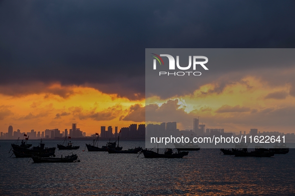 The sunset shines on the beach of Gujia Island in the West Coast New Area of Qingdao, Shandong province, China, on September 29, 2024. 