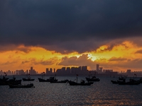 The sunset shines on the beach of Gujia Island in the West Coast New Area of Qingdao, Shandong province, China, on September 29, 2024. (