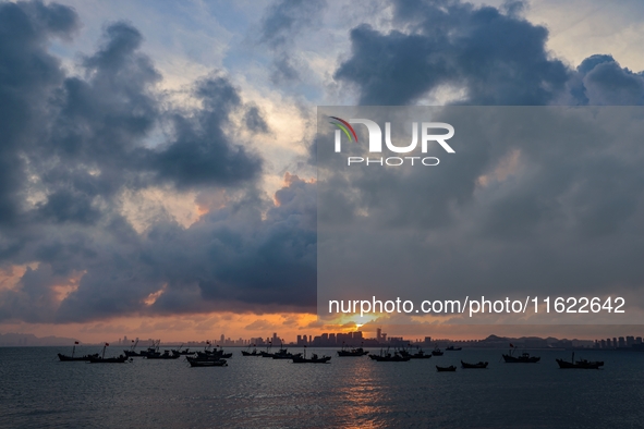 The sunset shines on the beach of Gujia Island in the West Coast New Area of Qingdao, Shandong province, China, on September 29, 2024. 