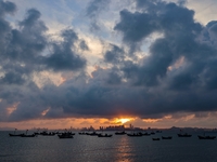 The sunset shines on the beach of Gujia Island in the West Coast New Area of Qingdao, Shandong province, China, on September 29, 2024. (