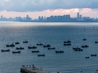 Fishing boats return to the coast of Gujia Island, a new area on the west coast of Qingdao, Shandong province, China, on September 29, 2024....