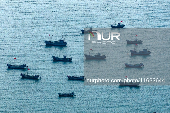 Fishing boats return to the coast of Gujia Island, a new area on the west coast of Qingdao, Shandong province, China, on September 29, 2024....