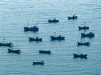 Fishing boats return to the coast of Gujia Island, a new area on the west coast of Qingdao, Shandong province, China, on September 29, 2024....