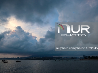 The sunset shines on the beach of Gujia Island in the West Coast New Area of Qingdao, Shandong province, China, on September 29, 2024. (