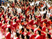 A large number of audience members and actors sing ''Me and My Motherland'' together at the celebration of the 75th anniversary of the found...