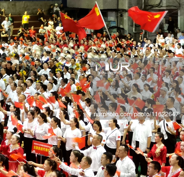 A large number of audience members and actors sing ''Me and My Motherland'' together at the celebration of the 75th anniversary of the found...