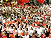 A large number of audience members and actors sing ''Me and My Motherland'' together at the celebration of the 75th anniversary of the found...