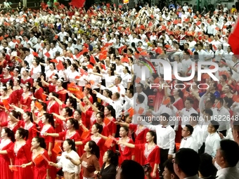 A large number of audience members and actors sing ''Me and My Motherland'' together at the celebration of the 75th anniversary of the found...