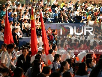 A large number of audience members and actors sing ''Me and My Motherland'' together at the celebration of the 75th anniversary of the found...