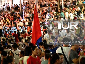 A large number of audience members and actors sing ''Me and My Motherland'' together at the celebration of the 75th anniversary of the found...