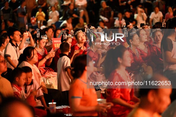 A large number of audience members and actors sing ''Me and My Motherland'' together at the celebration of the 75th anniversary of the found...