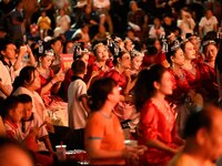 A large number of audience members and actors sing ''Me and My Motherland'' together at the celebration of the 75th anniversary of the found...