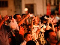 A large number of audience members and actors sing ''Me and My Motherland'' together at the celebration of the 75th anniversary of the found...