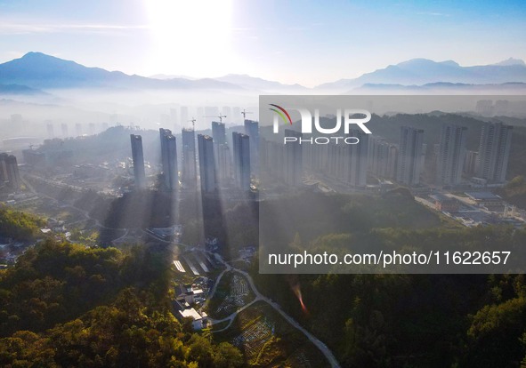 Buildings under construction are seen around the Yesban community in Anqing, China, on September 30, 2024. 