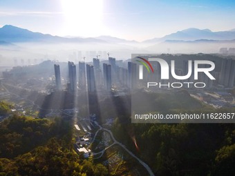 Buildings under construction are seen around the Yesban community in Anqing, China, on September 30, 2024. (