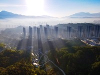 Buildings under construction are seen around the Yesban community in Anqing, China, on September 30, 2024. (