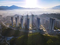 Buildings under construction are seen around the Yesban community in Anqing, China, on September 30, 2024. (