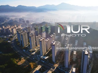 Buildings under construction are seen around the Yesban community in Anqing, China, on September 30, 2024. (