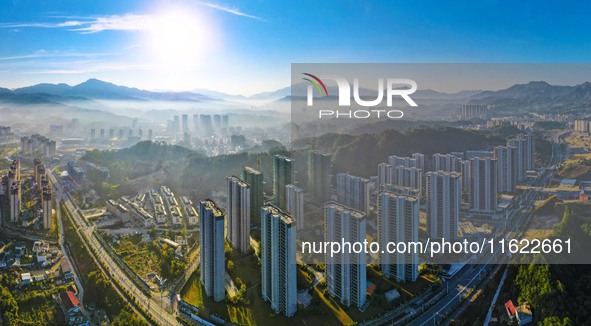 Buildings under construction are seen around the Yesban community in Anqing, China, on September 30, 2024. 