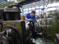 A worker works at an auto gear manufacturing company in Qingzhou Economic Development Zone in Qingzhou, China, on September 30, 2024. On the...