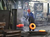 A worker works at an auto gear manufacturing company in Qingzhou Economic Development Zone in Qingzhou, China, on September 30, 2024. On the...