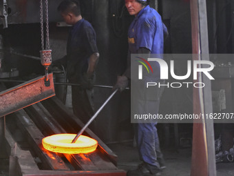 A worker works at an auto gear manufacturing company in Qingzhou Economic Development Zone in Qingzhou, China, on September 30, 2024. On the...