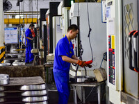 A worker works at an auto gear manufacturing company in Qingzhou Economic Development Zone in Qingzhou, China, on September 30, 2024. On the...