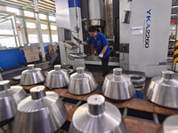 A worker works at an auto gear manufacturing company in Qingzhou Economic Development Zone in Qingzhou, China, on September 30, 2024. On the...