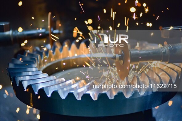 A worker works at an auto gear manufacturing company in Qingzhou Economic Development Zone in Qingzhou, China, on September 30, 2024. On the...