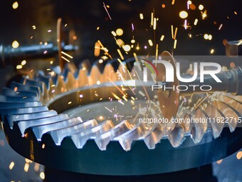 A worker works at an auto gear manufacturing company in Qingzhou Economic Development Zone in Qingzhou, China, on September 30, 2024. On the...