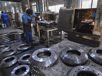 A worker works at an auto gear manufacturing company in Qingzhou Economic Development Zone in Qingzhou, China, on September 30, 2024. On the...