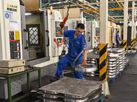 A worker works at an auto gear manufacturing company in Qingzhou Economic Development Zone in Qingzhou, China, on September 30, 2024. On the...