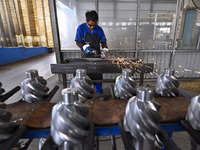 A worker works at an auto gear manufacturing company in Qingzhou Economic Development Zone in Qingzhou, China, on September 30, 2024. On the...