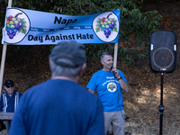 Napa community members participate in the inaugural Napa Day Against Hate at Westwood Hills Park, in Napa, Calif., on July 29, 2024. Dr. Pet...