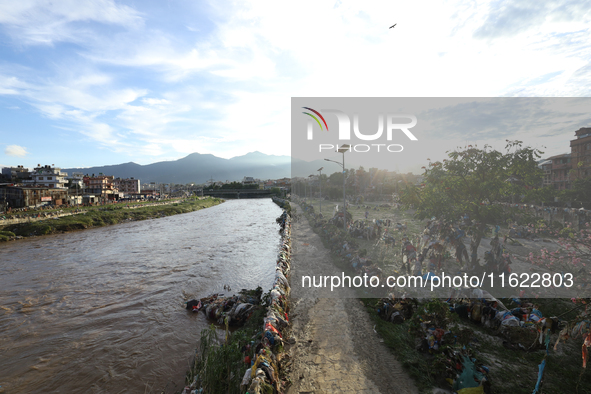 Plastics remain entangled in the branches of trees and infrastructures along the embankments of the Bagmati River in Kathmandu, Nepal, on Se...