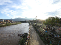 Plastics remain entangled in the branches of trees and infrastructures along the embankments of the Bagmati River in Kathmandu, Nepal, on Se...