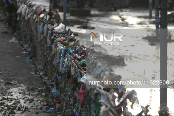 Plastics remain entangled in the bars along the embankments of Bagmati River in Kathmandu, Nepal, on September 29, 2024. Nepal on Saturday,...