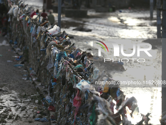 Plastics remain entangled in the bars along the embankments of Bagmati River in Kathmandu, Nepal, on September 29, 2024. Nepal on Saturday,...