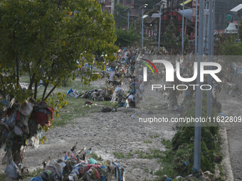 Plastics remain entangled in the branches of trees and infrastructures along the embankments of the Bagmati River in Kathmandu, Nepal, on Se...