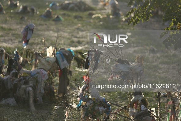 Plastics remain entangled in the branches of trees and infrastructures along the embankments of the Bagmati River in Kathmandu, Nepal, on Se...