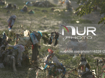 Plastics remain entangled in the branches of trees and infrastructures along the embankments of the Bagmati River in Kathmandu, Nepal, on Se...