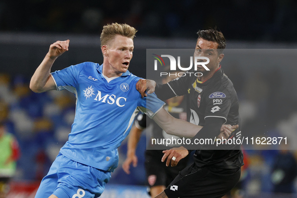 Scott McTominay and Monza's Armando Izzo participate in the Serie A soccer match between SSC Napoli and Monza at Stadio Maradona in Naples,...