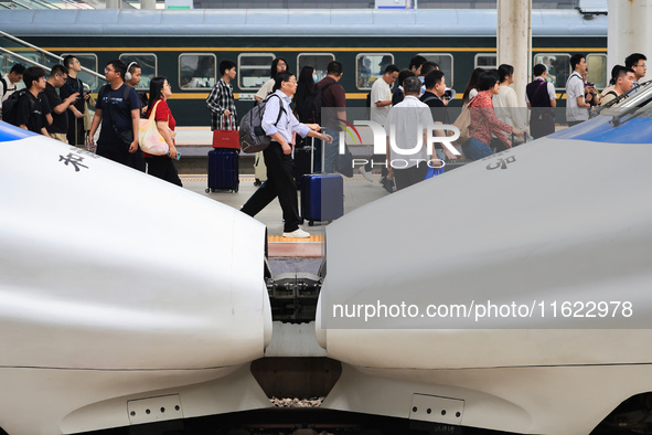 Passengers travel at Nanjing Railway Station in Nanjing, China, on September 30, 2024. 