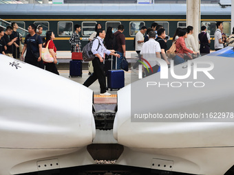 Passengers travel at Nanjing Railway Station in Nanjing, China, on September 30, 2024. (