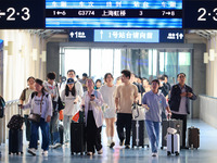 Passengers travel at Nanjing Railway Station in Nanjing, China, on September 30, 2024. (