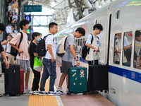 Passengers travel at Nanjing Railway Station in Nanjing, China, on September 30, 2024. (