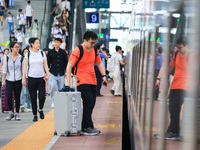 Passengers travel at Nanjing Railway Station in Nanjing, China, on September 30, 2024. (