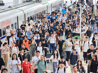 Passengers travel at Nanjing Railway Station in Nanjing, China, on September 30, 2024. (