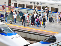 Passengers travel at Nanjing Railway Station in Nanjing, China, on September 30, 2024. (