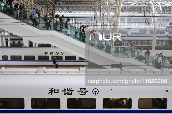 Passengers travel at Nanjing Railway Station in Nanjing, China, on September 30, 2024. 